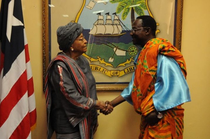 President Sirleaf shakes hands with Ambassador Asare-Asieou following the ceremony 